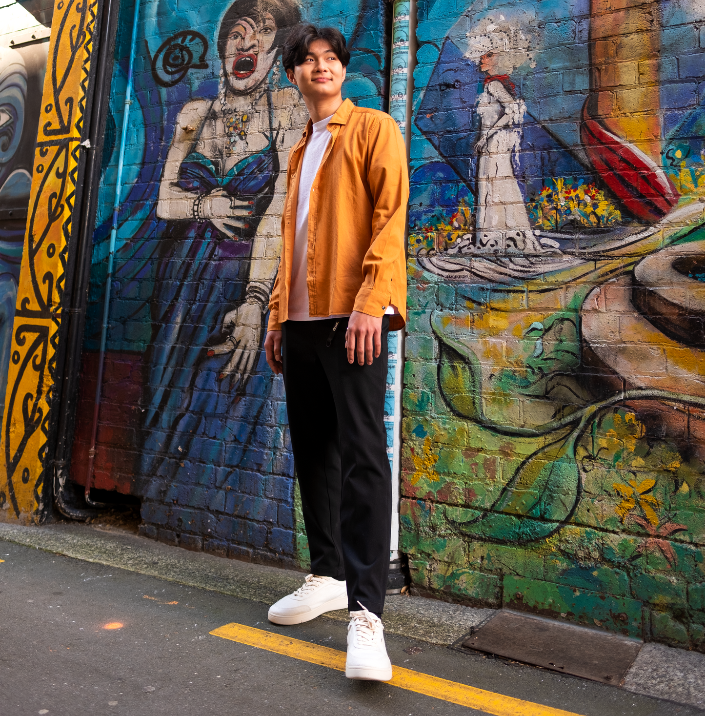 Man wearing Orba Ghost sneaker in trendy alley