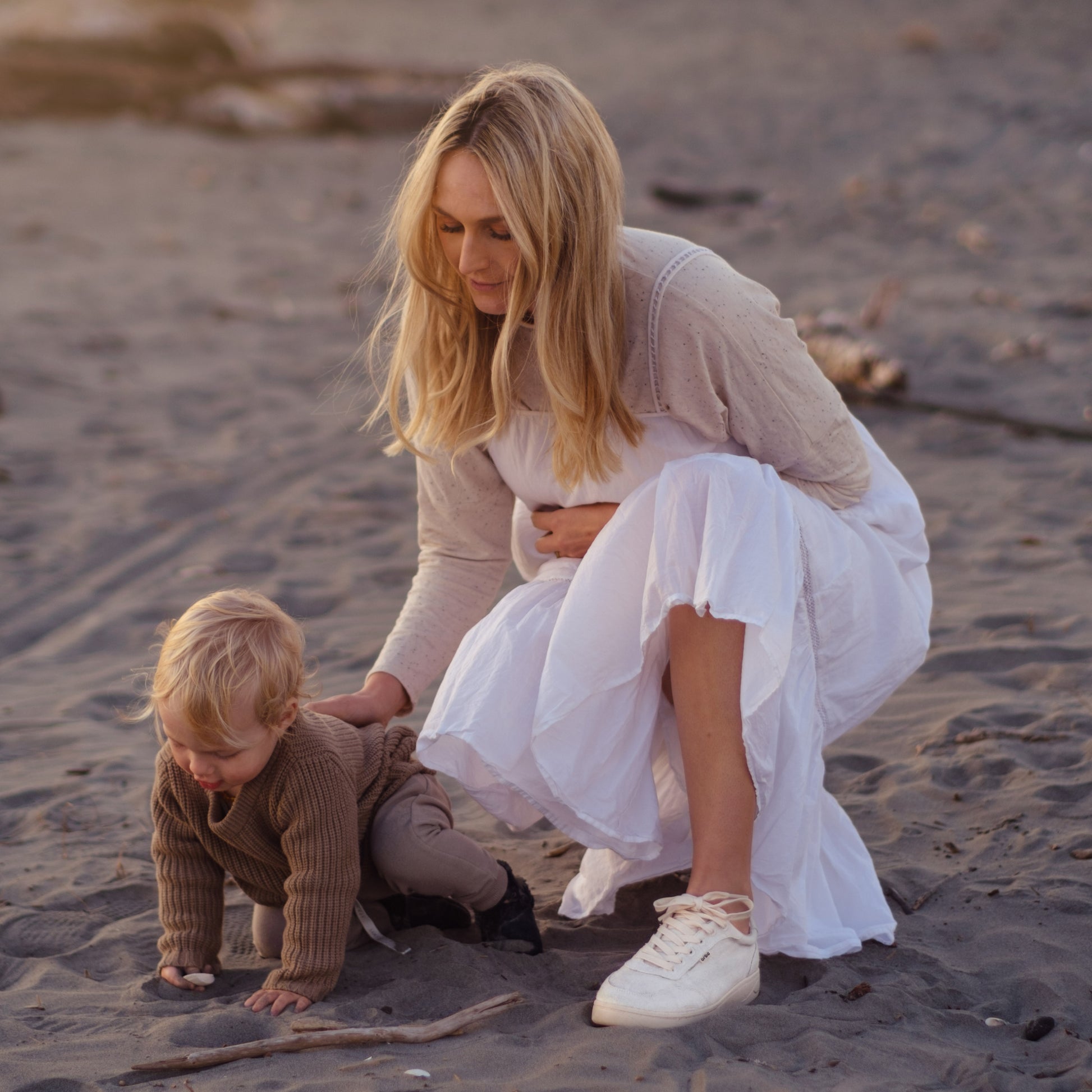 Mother playing with child wearing Orba Ghost Sneakers