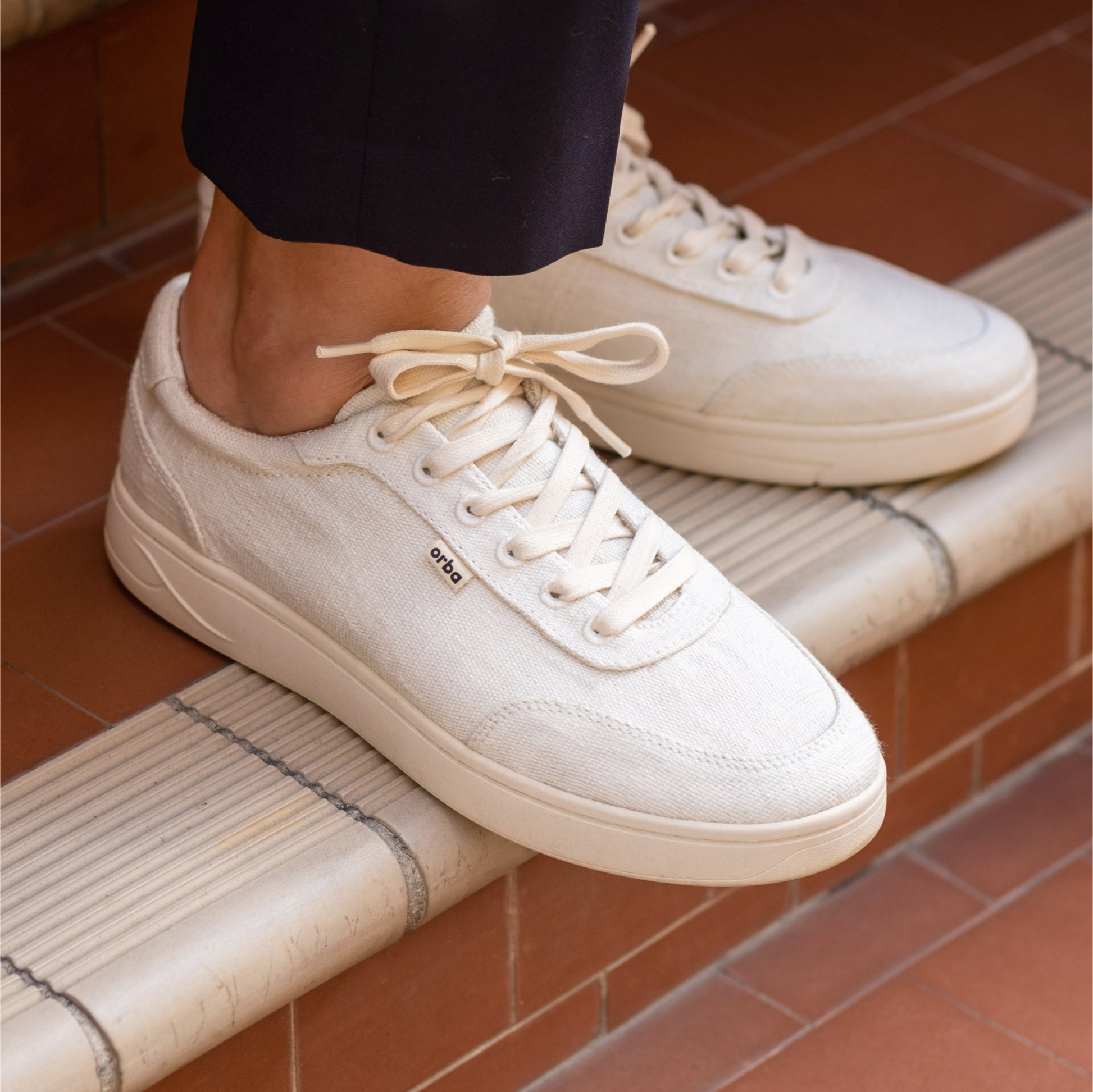 Close up of Orba Ghost Sneakers on stairs